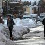 Pedestrians walked on Bow Street in Cambridge Wednesday. 