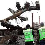 Members of a Dutch export team watched as parts of the wreckage of the Malaysia Airlines Flight MH17 were removed from the crash site in eastern Ukraine in November 2014.