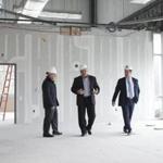 From left, Potpourri CEO Jonathan Fleischmann, vice president Taras Kowalczyn, and developer Littleton Land?s Don O?Neill toured Potpourri?s future call center.