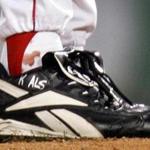 FILE - In this Oct. 24, 2004, file photo, blood appears around the right ankle of Boston Red Sox pitcher Curt Schilling during the sixth inning of Game 2 of baseball's World Series against the St. Louis Cardinals in Boston. Schilling, whose video game company underwent a spectacular collapse into bankruptcy last year, is selling the blood-stained sock he wore during that game. (AP Photo/Winslow Townson, File)