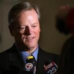 Boston, MA--2/26/2015--Governor Charlie Baker (cq) talks to the media about his meeting with Keolis executive Bernard Tabary (cq), at the State House, on Thursday, February 26, 2015. Pat Greenhouse/Globe Staff Topic: 27keolis Reporter: XXX