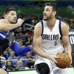 Dallas Mavericks' Andrew Bogut (6) looks for a shot against Orlando Magic's Nikola Vucevic during the first half of an NBA basketball game, Saturday, Nov. 19, 2016, in Orlando, Fla. (AP Photo/John Raoux)