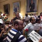 Boston, MA - 8/25/2016 - MBTA janitors hold a sit-in at Governor Charlie Baker's office protesting budget cuts which will likely mean janitor layoffs. - (Barry Chin/Globe Staff), Section: Metro, Reporter: David Scharfenberg, Topic: 26janitors, LOID: 8.2.4106712288.