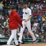 Boston, MA--5/27/2018-- Red Sox manager Alex Cora (L) takes starting pitcher Chris Sale (R) out of the game during the fifth inning of the Red Sox v. Braves at Fenway Park. (Jessica Rinaldi/Globe Staff) Topic: Reporter: 