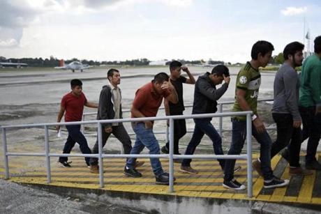 Guatemalan immigrants deported from the United States arrive at the Air Force base in Guatemala City on June 22, 2018.
