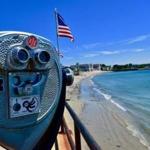 Coin-operated telescopes enhance the view along Stacey Boulevard in Gloucester.