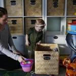 Jessica Luque, the facilitator of Real Talk Real Moms, plays with her daughter, Penny, 1, at their home in Lynn.