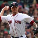 Boston, MA - 06/14/14 - (4th inning) Boston Red Sox starting pitcher Jake Peavy (44) fires to first base on a sacrifice bunt by Cleveland Indians first baseman Nick Swisher (33) in the fourth inning. The Boston Red Sox take on the Cleveland Indians in Game 3 of a four game series at Fenway Park. - (Barry Chin/Globe Staff), Section: Sports, Reporter: Peter Abraham, Topic: 15Red Sox-Indians, LOID: 7.3.3740472207.