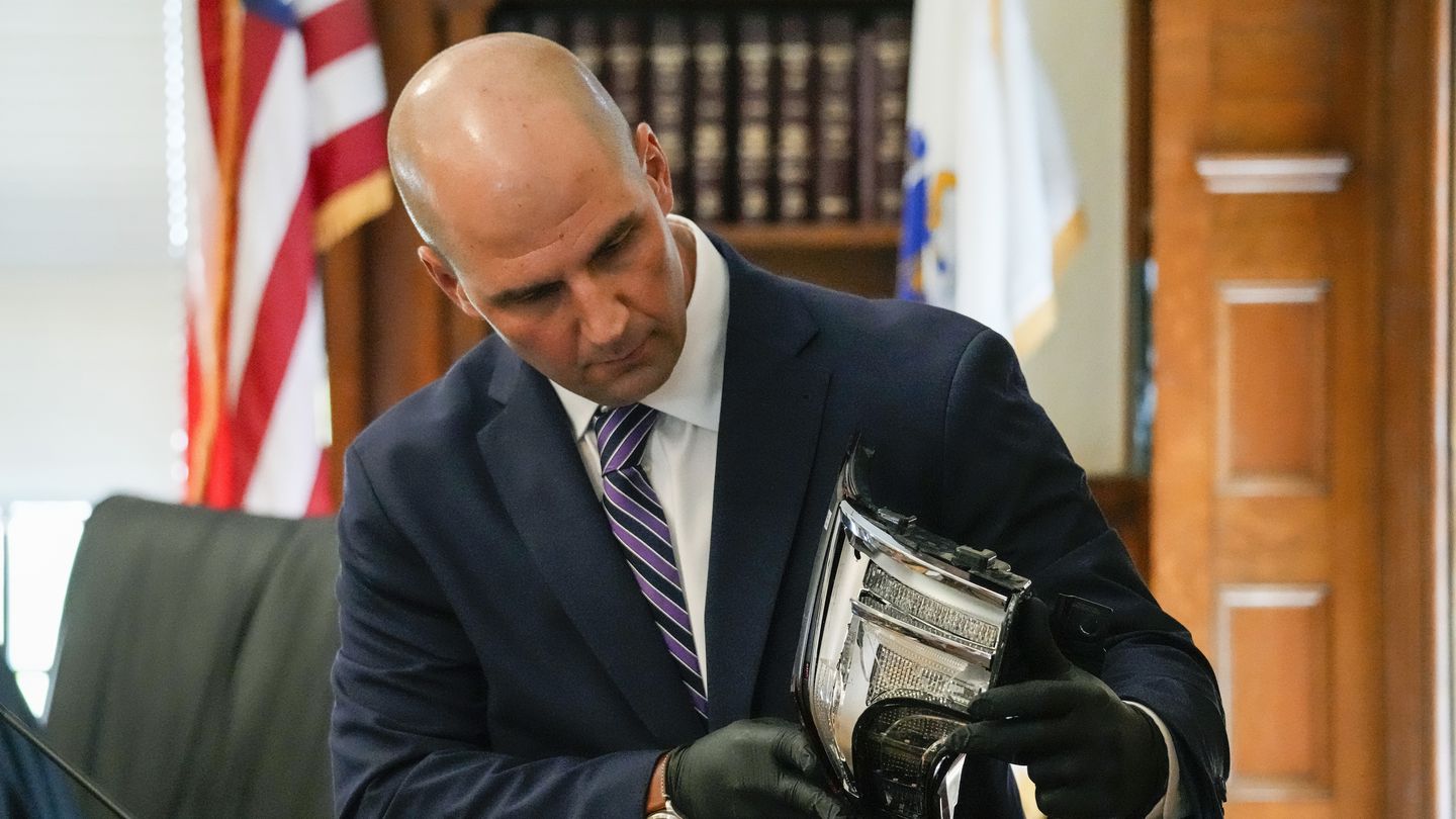 Massachusetts State Police Trooper Michael Proctor showed the jury a broken taillight while testifying on Monday at Norfolk Superior Court in Dedham, during the murder trial of Karen Read.