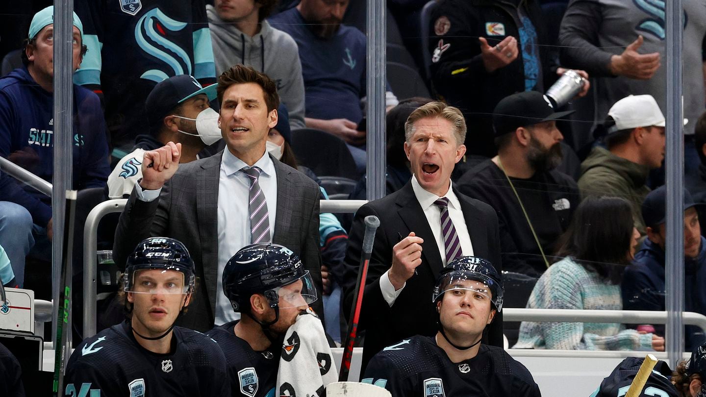 Jay Leach (left) was an assistant coach with the Seattle Kraken after moving on from leading the AHL's Providence Bruins.