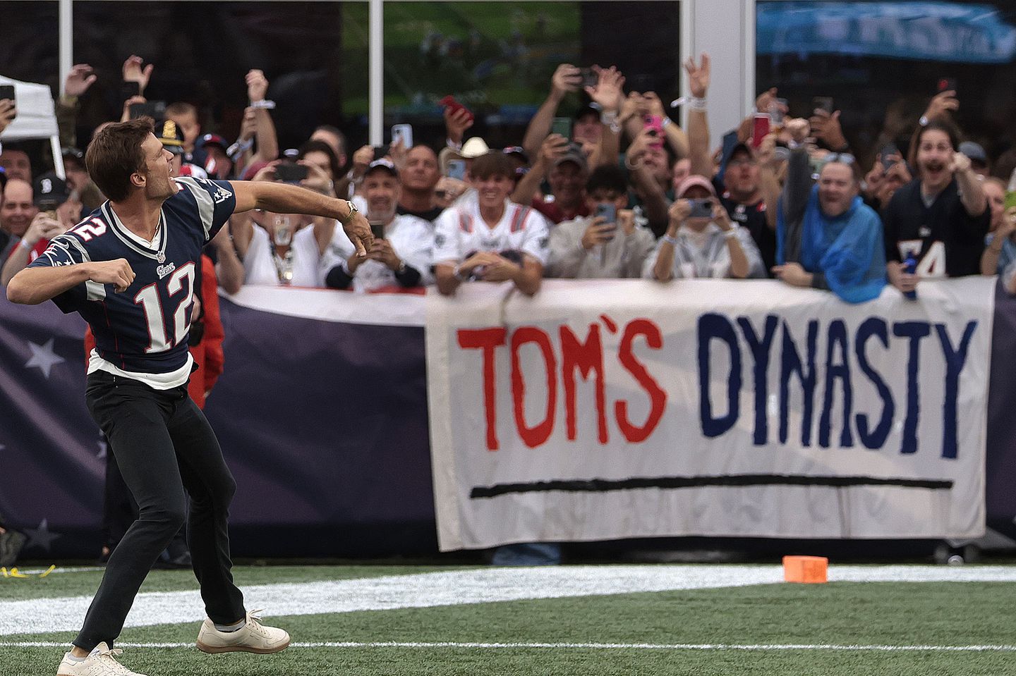 Tom Brady runs out to the fans in the end zone Sept. 10 on his last visit to Gillette Stadium during halftime ceremonies when the Patriots played the Philadelphia Eagles.