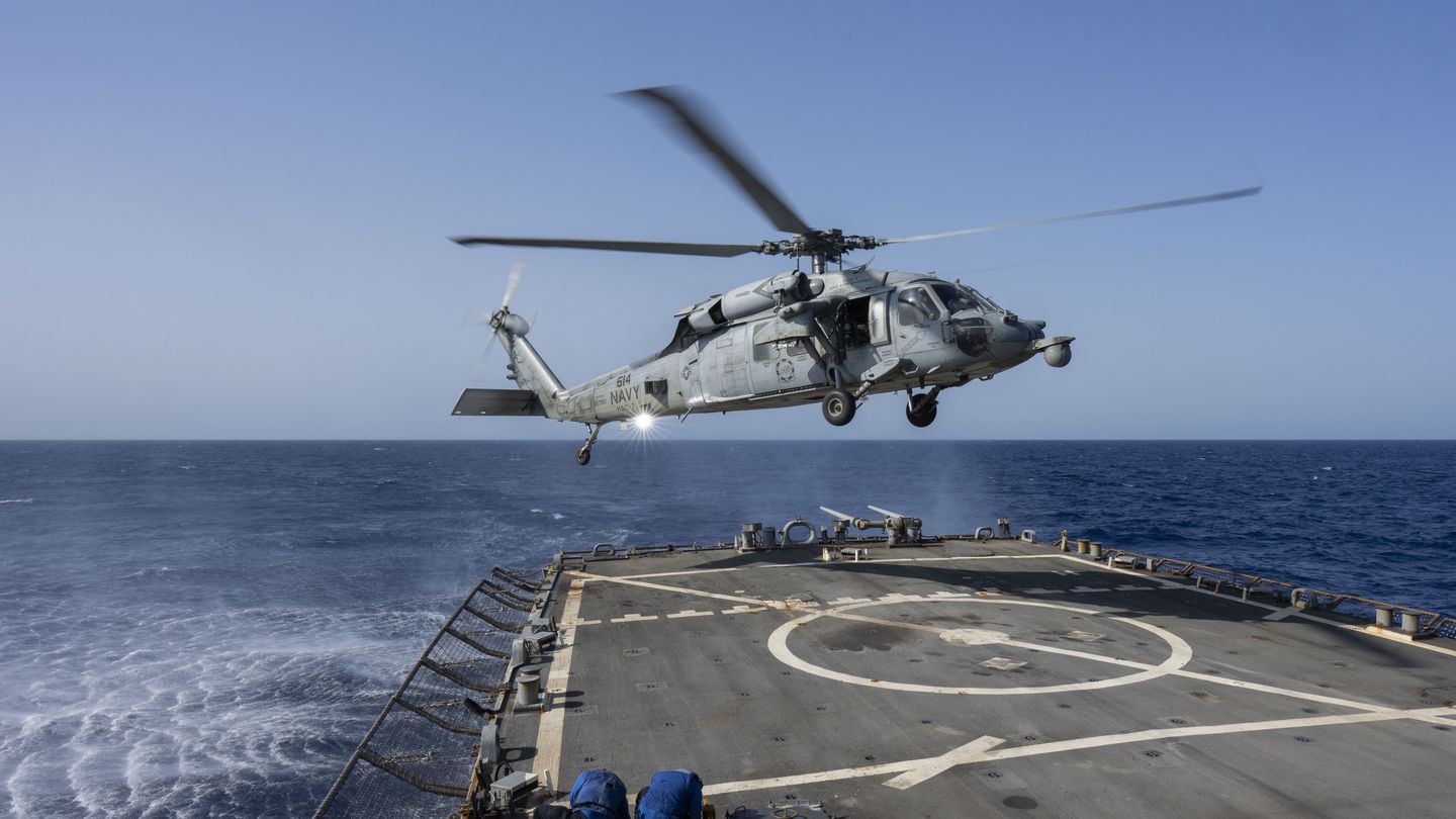 An HSC-7 helicopter lands on the Arleigh Burke-class guided missile destroyer USS Laboon in the Red Sea, on June 12.