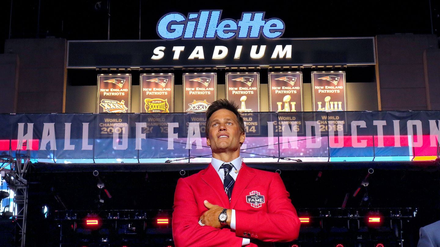 As the ceremony concluded, Tom Brady stood alone on the Gillette Stadium stage and soaked it all in.