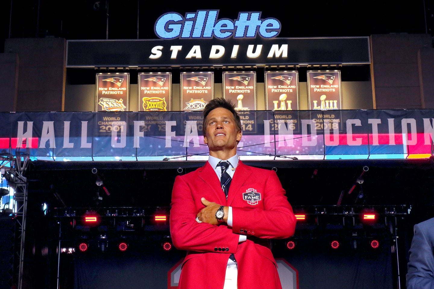 As the ceremony concluded, Tom Brady stood alone on the Gillette Stadium stage and soaked it all in.