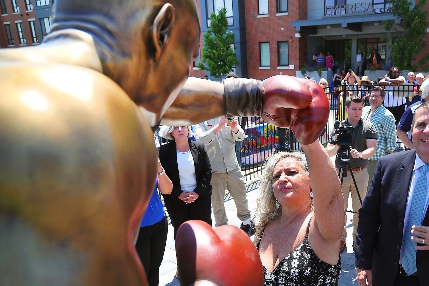 Kay Hagler, widow of Marvin Hagler, touched the glove of statue after unveiling Thursday morning in the heart of Brockton Center, a block from where he trained.