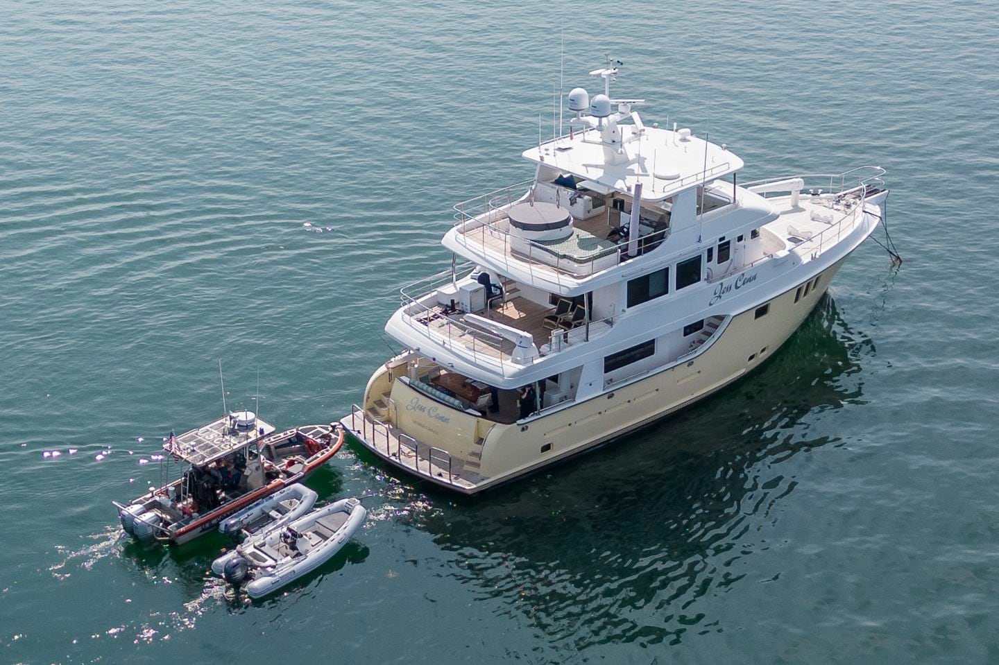 A Coast Guard patrol boat is tied to the yacht Jess Conn in Nantucket Harbor in September 2023.