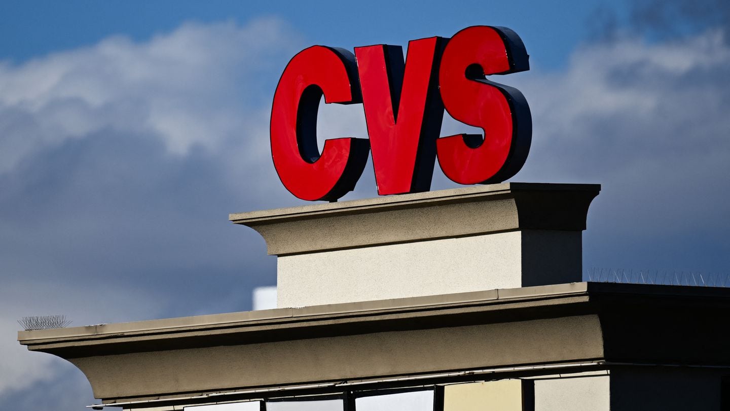 The CVS pharmacy logo is displayed on a sign above a CVS Health Corp. store.
