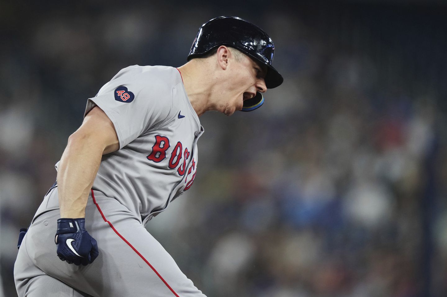 Tyler O'Neill celebrates his solo home run in the top of the eighth that helped the Red Sox tie the game, 3-3, against the Blue Jays.