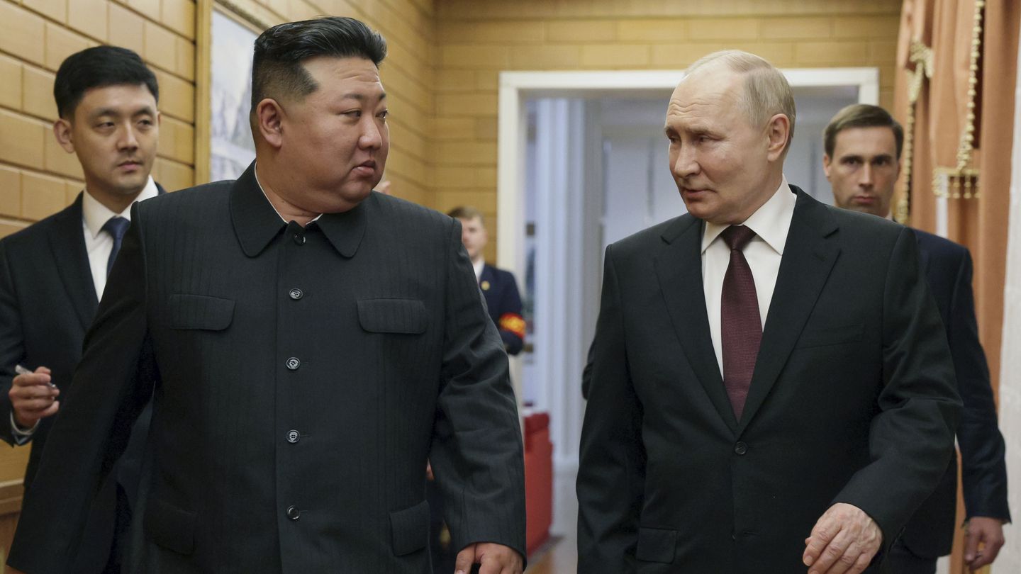 Russian President Vladimir Putin and North Korea's leader Kim Jong Un talk to each other during their meeting in Pyongyang, North Korea, on June 19.