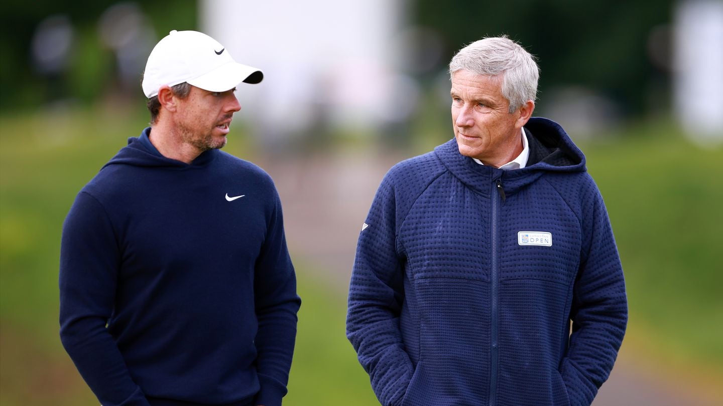 Rory McIlroy talks with PGA commissioner Jay Monahan during the RBC Canadian Open on May 29.