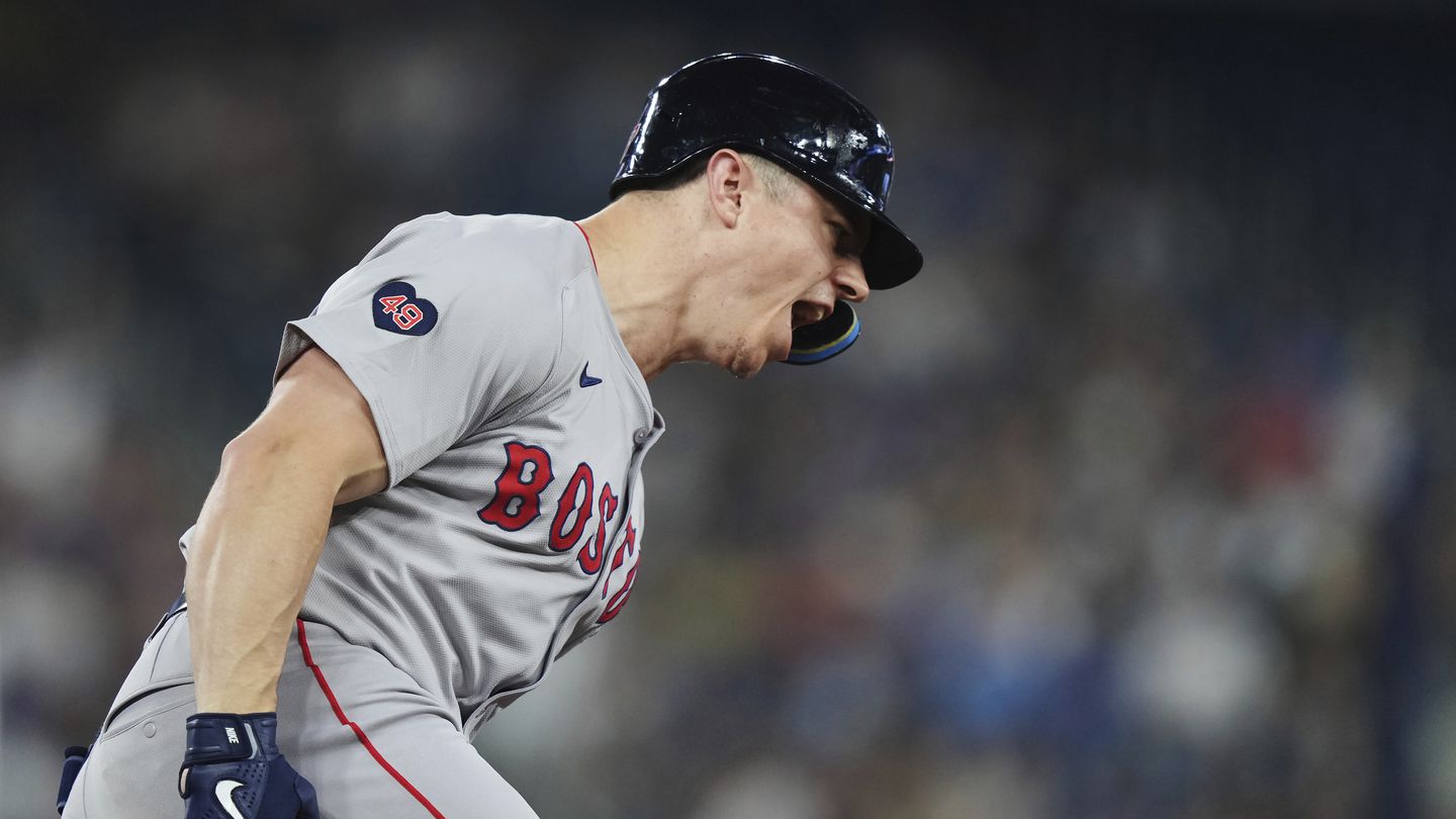 Tyler O'Neill celebrates his solo home run in the top of the eighth that helped the Red Sox tie the game, 3-3, against the Blue Jays.