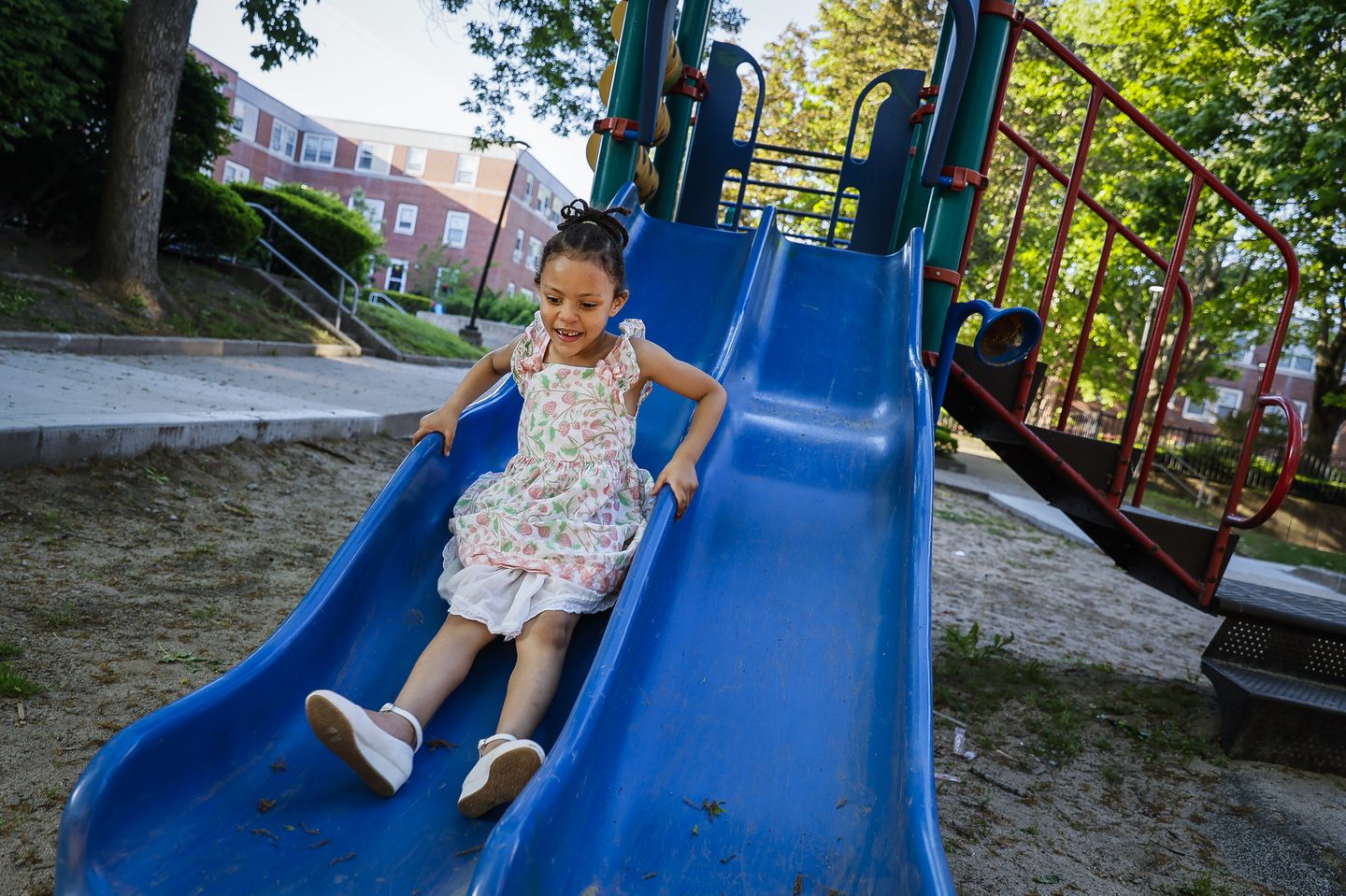 Jaylene Macedo played in the playground near her family’s new Brighton apartment. She, her sister, and mother, Natalia Macedo, were homeless for seven months before they were able to move into an apartment in Brighton.