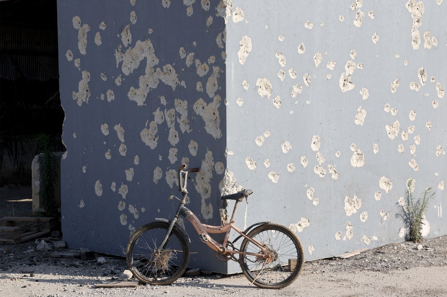A bicycle rested near the wall of a shelter riddled with bullets during the Oct. 7 attacks carried out by Palestinian militants from the Gaza Strip, at Kibbutz Nahal Oz in southern Israel on June 13, 2024 amid the ongoing conflict in the Palestinian territory between Israel and Hamas.