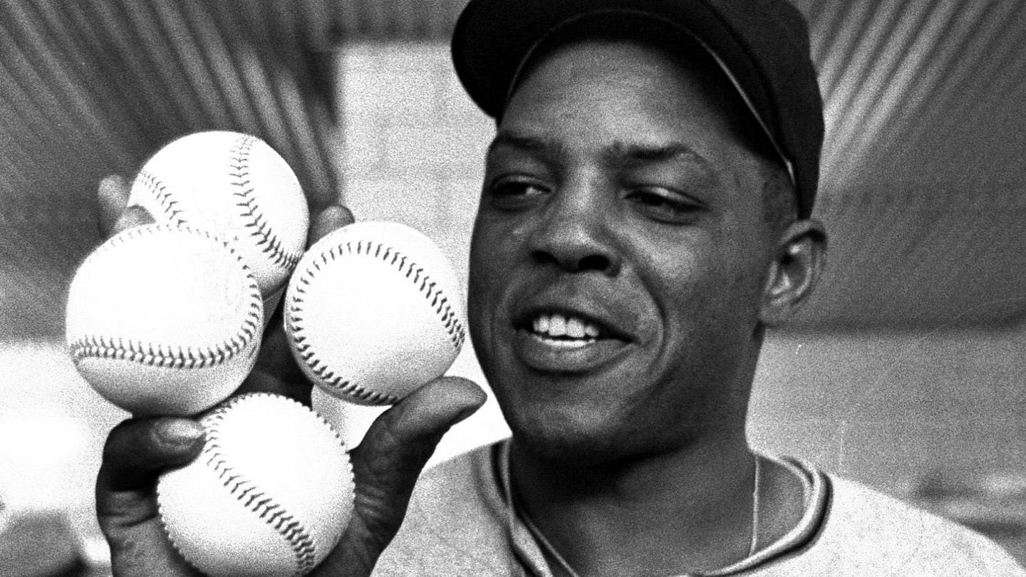 San Francisco Giants outfielder Willie Mays displays the four baseballs in the clubhouse representing the four homers which he hit against the Milwaukee Braves, April 30, 1961, in Milwaukee.