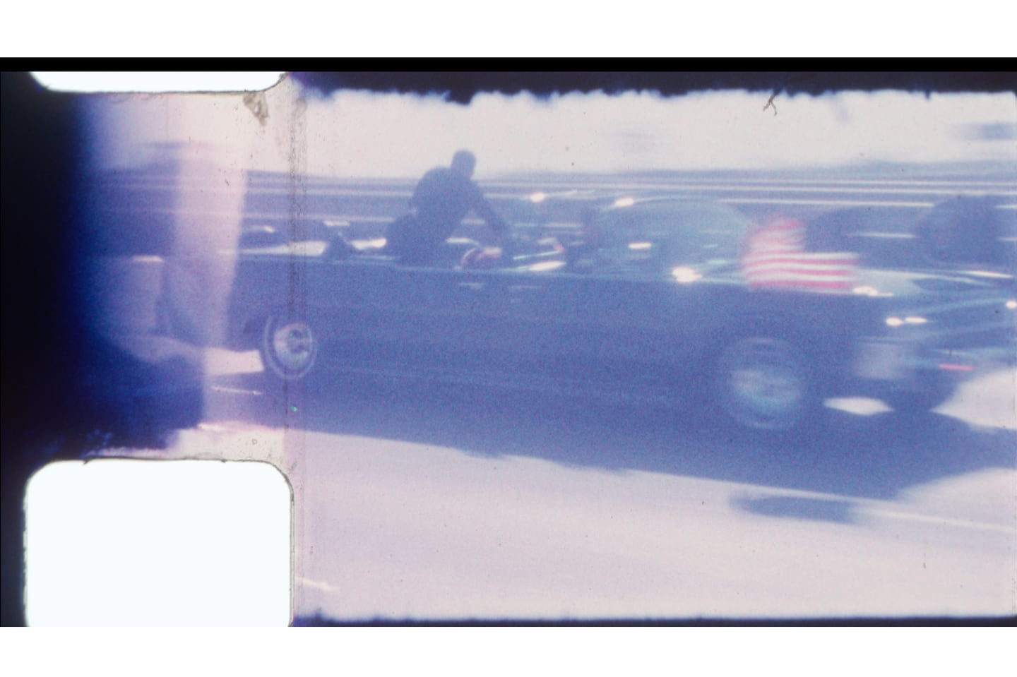 An undated image released by RR Auction shows home film footage of President John F. Kennedy's motorcade speeding down a Dallas freeway to the hospital after he was fatally wounded on Nov. 22, 1963.