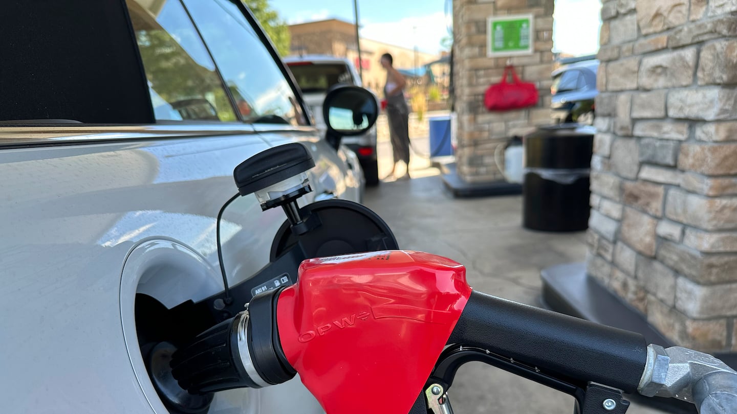 A motorist filled up the gasoline tank of a vehicle at a Costco warehouse on Aug. 22 in Parker, Colo.