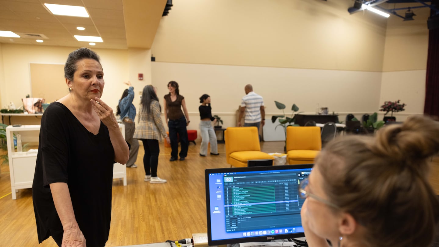 Mariela López-Ponce talked to stage manager Emily Larson while the cast of "Laughs in Spanish" rehearsed.