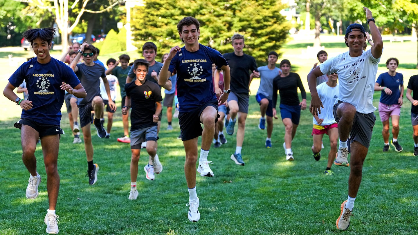 The Lexington boys' cross-country, led by (from left to right, front) captains Max Zhang, Will Fletcher and Kabir Gokarn, goes through its paces during a warmup for a recent practice session at Hastings Park.