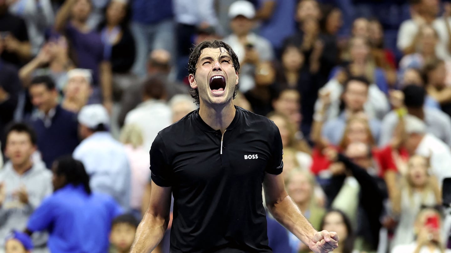 Taylor Fritz celebrates advancing to his first Grand Slam final with his US Open semifinal victory over fellow American Frances Tiafoe Friday night in New York City.