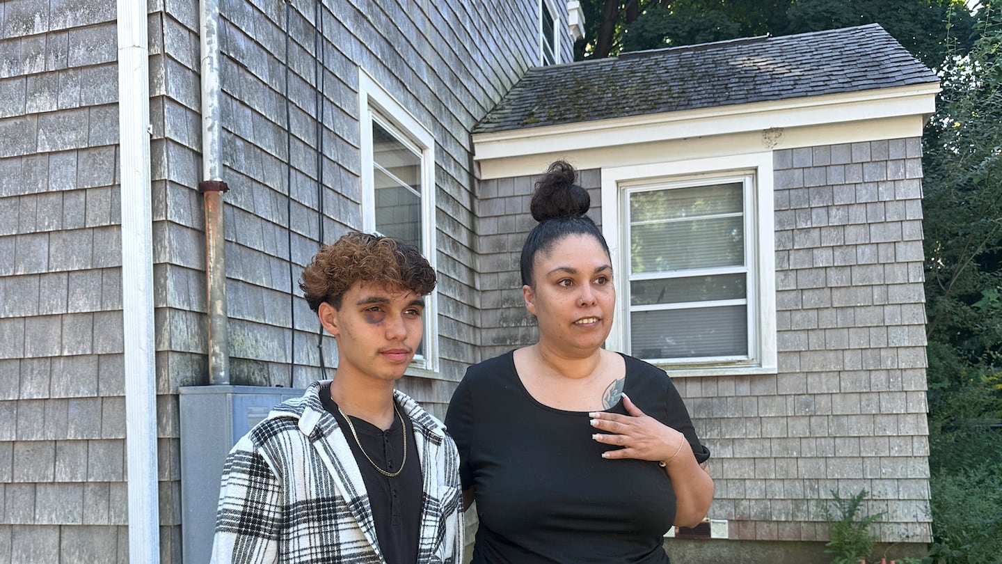 Jayden Tkaczyk stands outside his Gloucester home with his mother, Jasmine Tkaczyk. Jayden Tkaczyk says he was beaten up at a party because he is transgender.