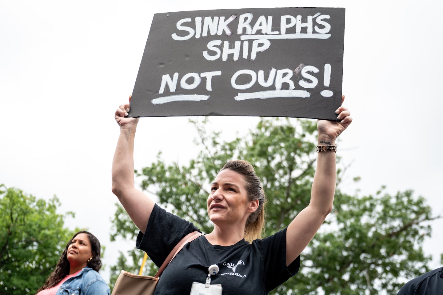 A woman who said she had worked in Carney Hospital’s emergency department for 13 years attended a press conference about Steward at Carney Hospital in Dorchester on July 29.