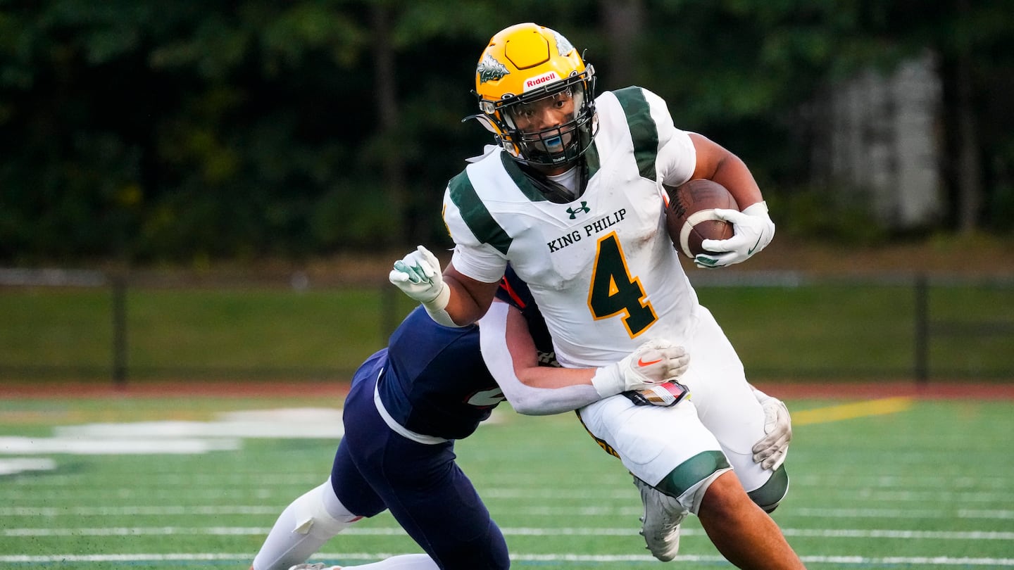 King Philip’s Keigan Canto-Osorio (4) shed a few tackles in racking up 130 yards rushing and a pair touchdowns, along with a 2-point conversion, in a 42-14 victory over Walpole Friday night.