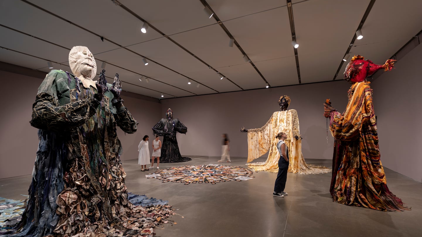 Installation view, "Tau Lewis: Spirit Level," at the Institute of Contemporary Art/Boston. From left: "The Doula," "The Night Woman," "The Handle of the Axe," "The Reaper." On the floor: "The Last Transmission."