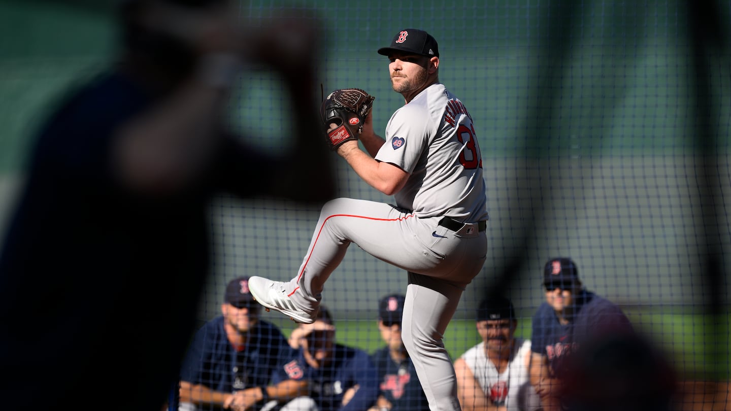 Liam Hendriks throws a live batting practice session in Kansas City last month.