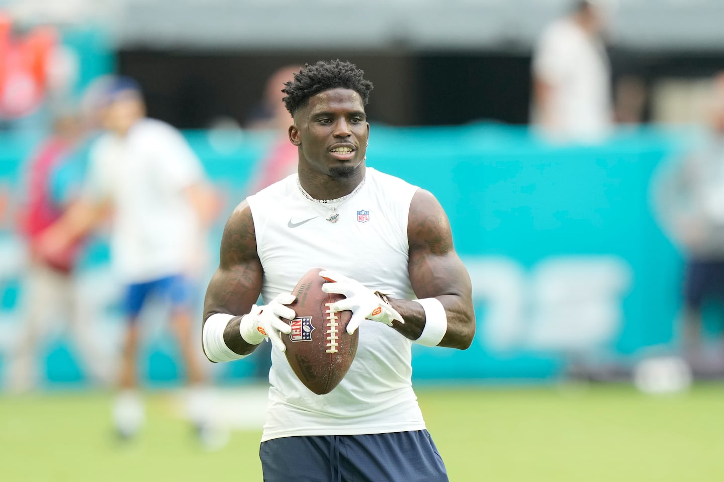 Miami Dolphins wide receiver Tyreek Hill warms up before a preseason NFL football game against the Washington Commanders, Saturday, Aug. 17, 2024, in Miami Gardens, Fla.