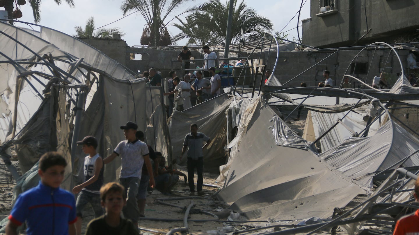 Displaced Palestinians gathered after Israeli airstrikes on the humanitarian area known as Al-Mawasi in Khan Younis, southern Gaza, Tuesday.