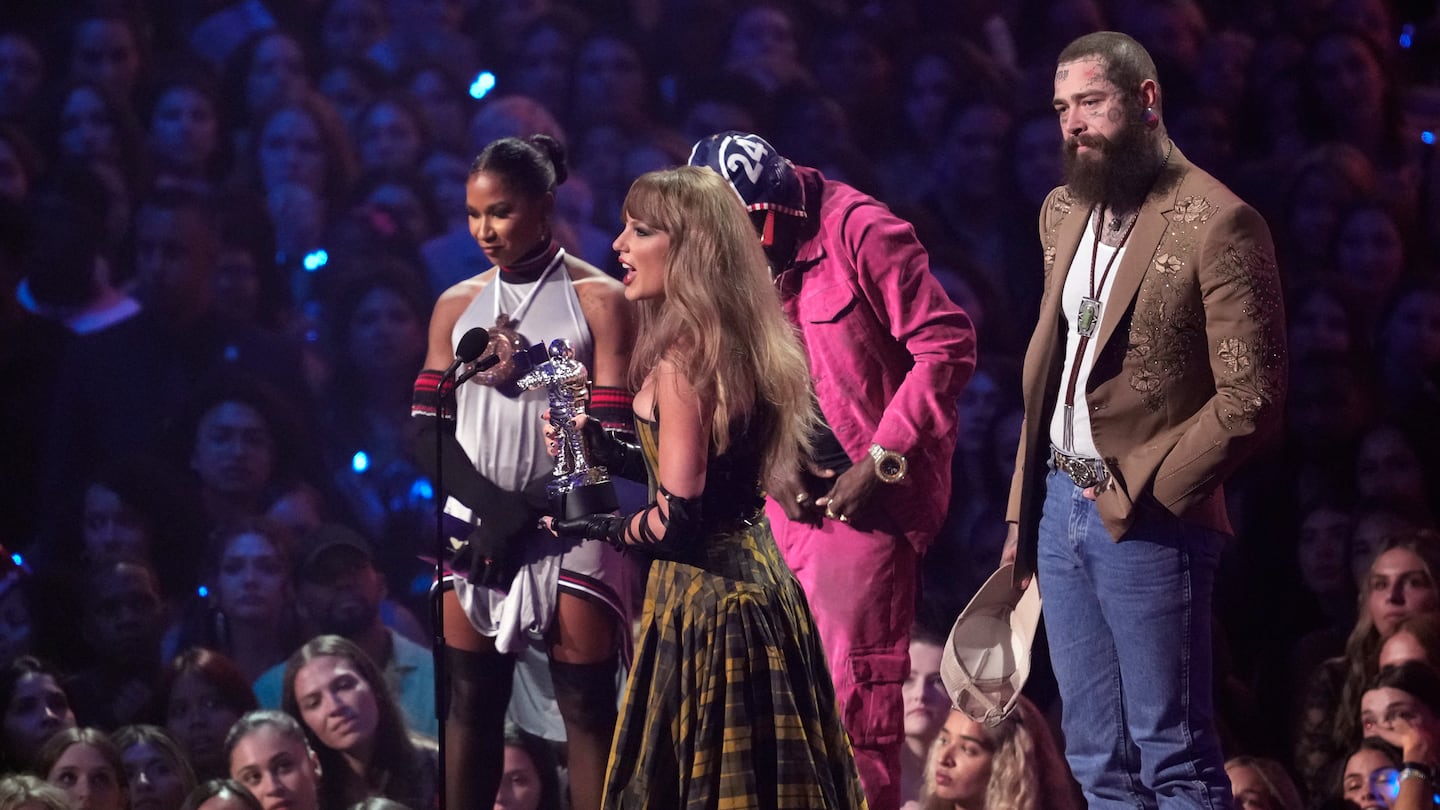 Taylor Swift and Post Malone accept the award for best collaboration for "Fortnight" during the MTV Video Music Awards on Sept. 11, at UBS Arena in Elmont, N.Y.