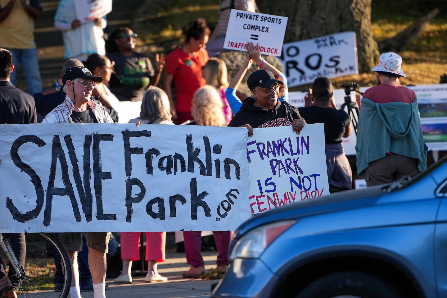 Allan Ihrer and Connie Forbes joined other local residents and parks advocates at Franklin Park to highlight local opposition to the private stadium complex and express their support for a fully-public renovation of White Stadium.