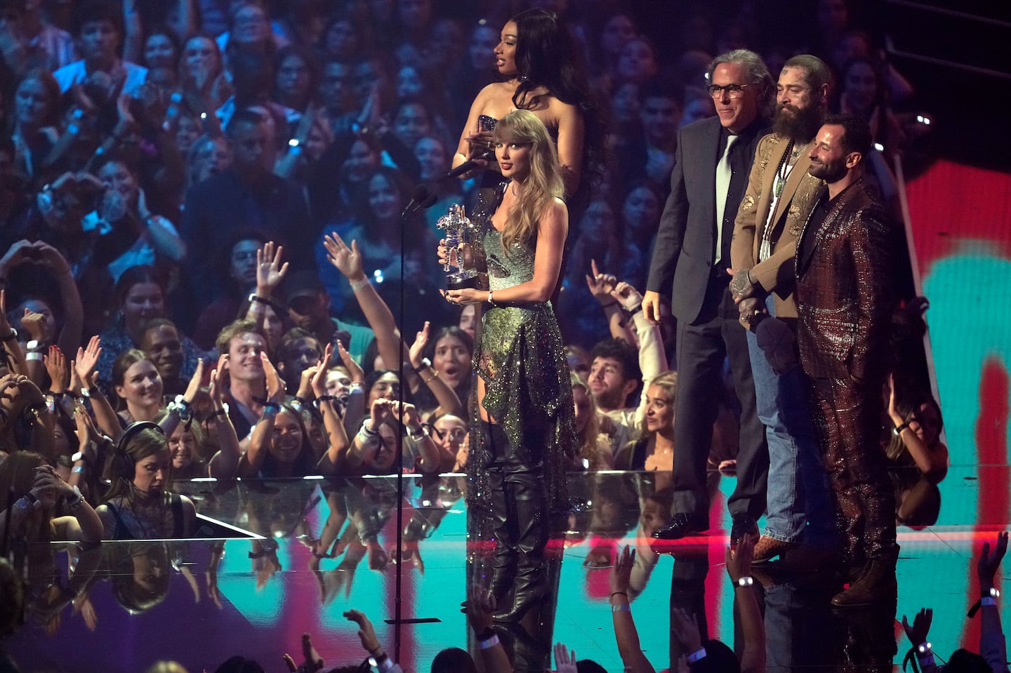 Taylor Swift and Post Malone accept the video of the year award for "Fortnight" during the MTV Video Music Awards on Sept. 11, at UBS Arena in Elmont, N.Y.