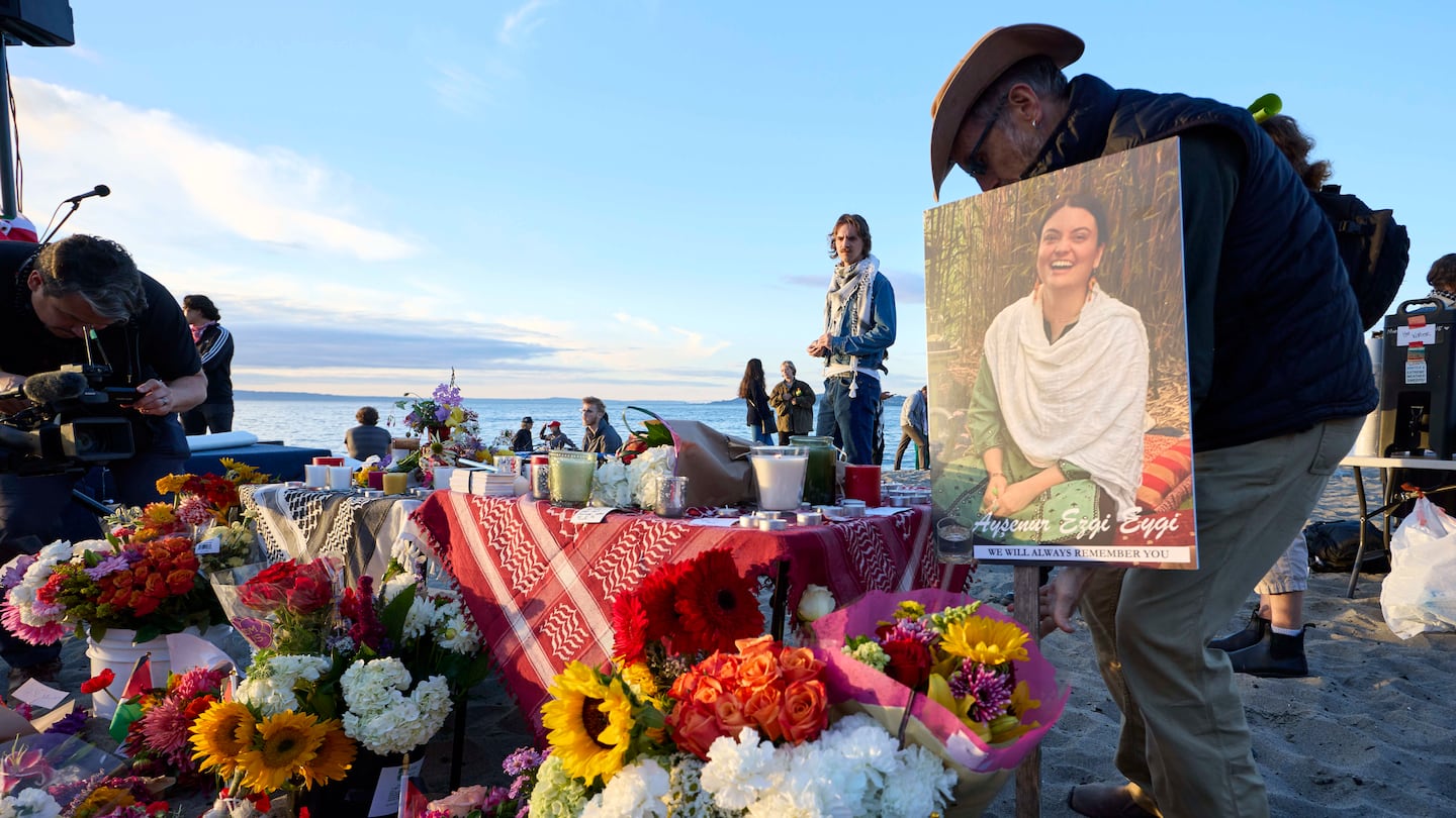 A photo is placed among flowers in memory of the death of the 26-year old Aysenur Ezgi Eygi at vigil on Alki Beach, killed recently in the occupied West Bank, on Sept. 11, in Seattle.