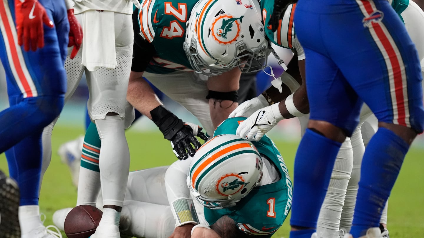 Dolphins quarterback Tua Tagovailoa went down after colliding with Damar Hamlin in the third quarter Thursday.