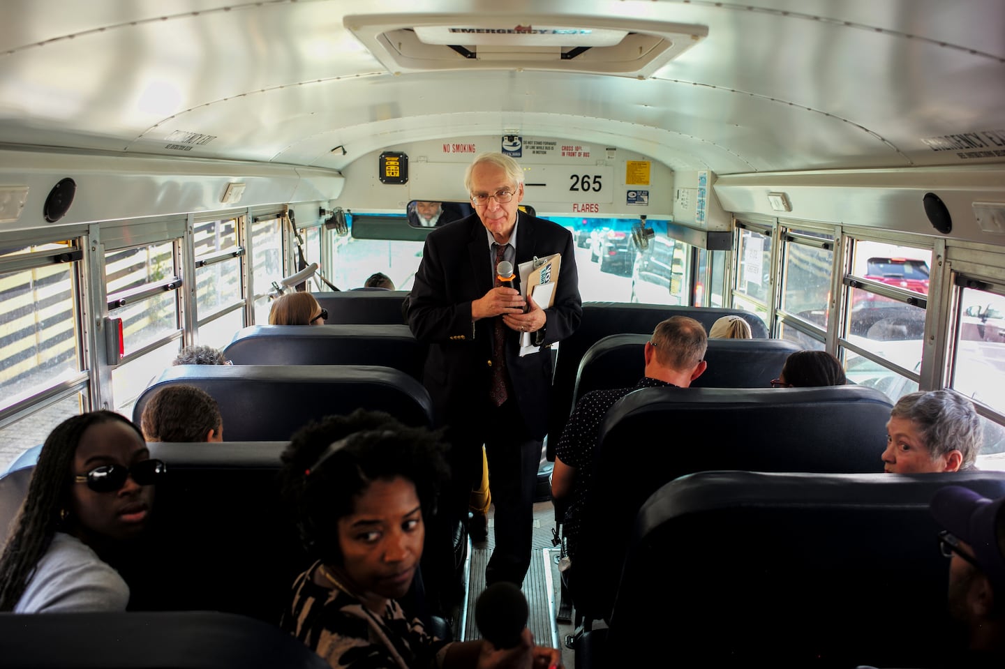 Lewis Finfer lead the tour that was taken to some sites on a school bus.