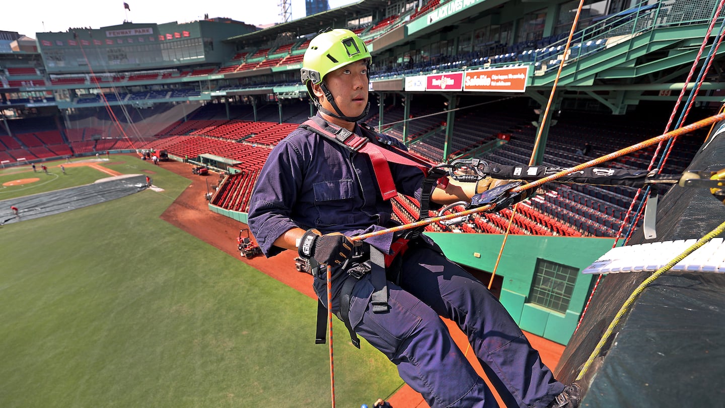 Reagan Li rappelled from the Green Monster during a joint training event for Massachusetts technical rescue teams at Fenway Park.  He is a firefighter with Boston's Engine 10.