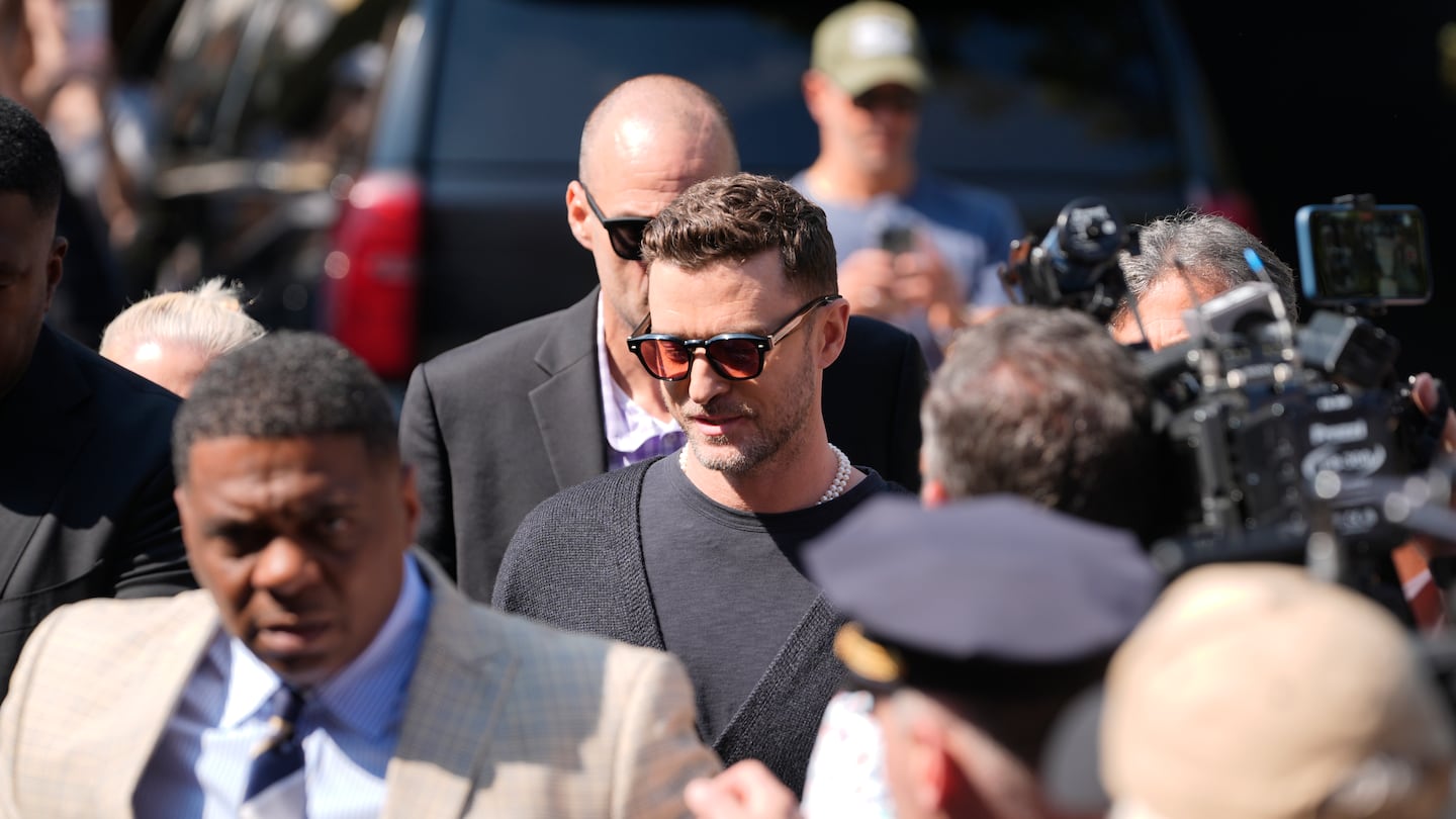 Justin Timberlake, center, walked into court for his arraignment on Friday in Sag Harbor, N.Y.