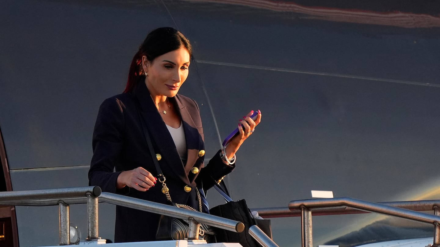 Laura Loomer arrives with Republican presidential nominee former President Donald Trump at Philadelphia International Airport, Tuesday, Sept. 10, in Philadelphia, for the presidential debate.