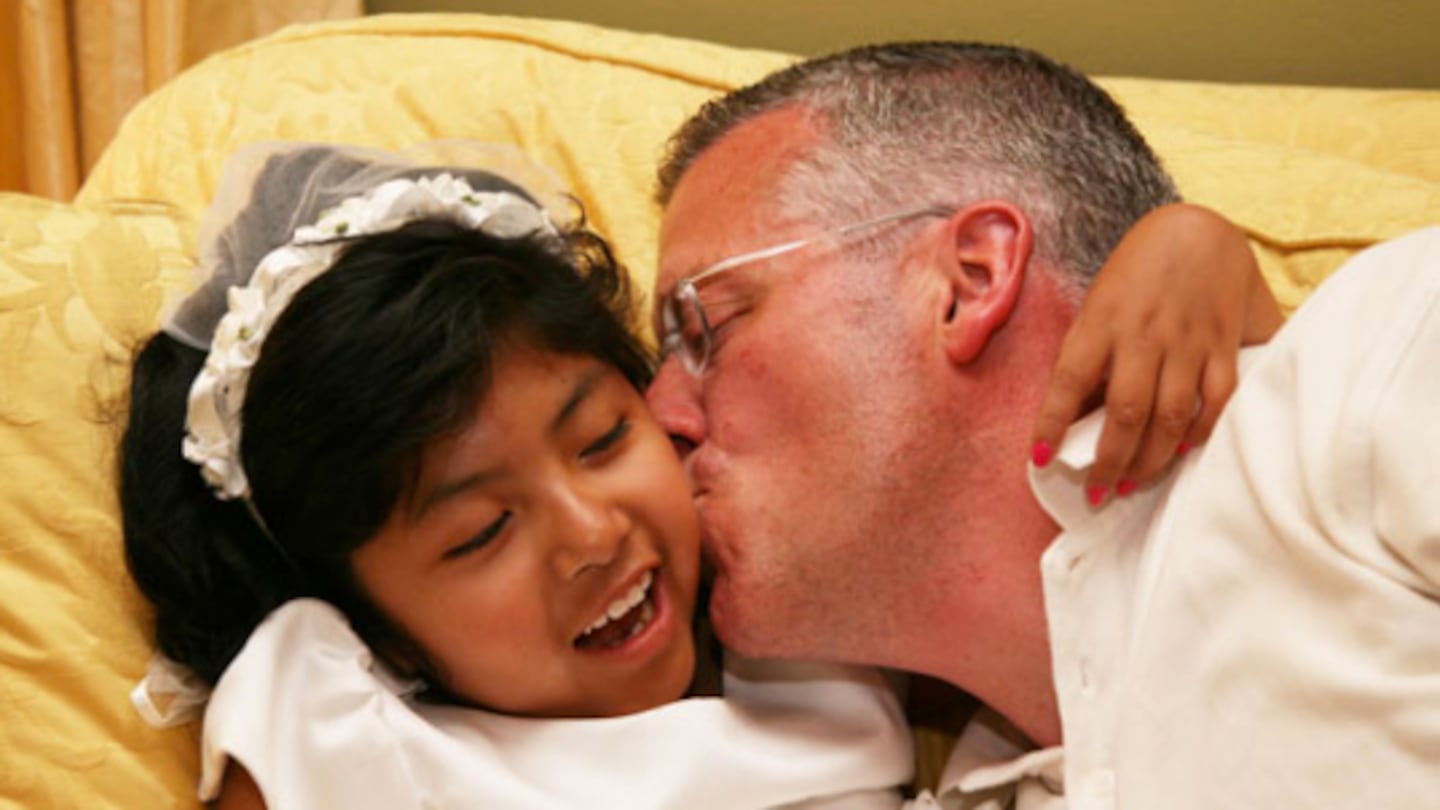 Tom O'Brien kissed his daughter Marisol.